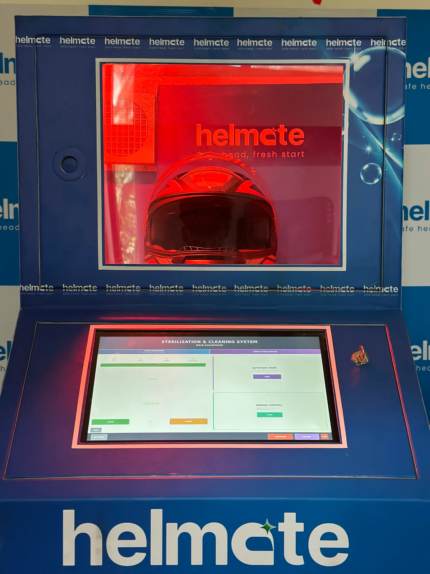 A helmet inside the Helmate machine's UV chamber above the touchscreen console