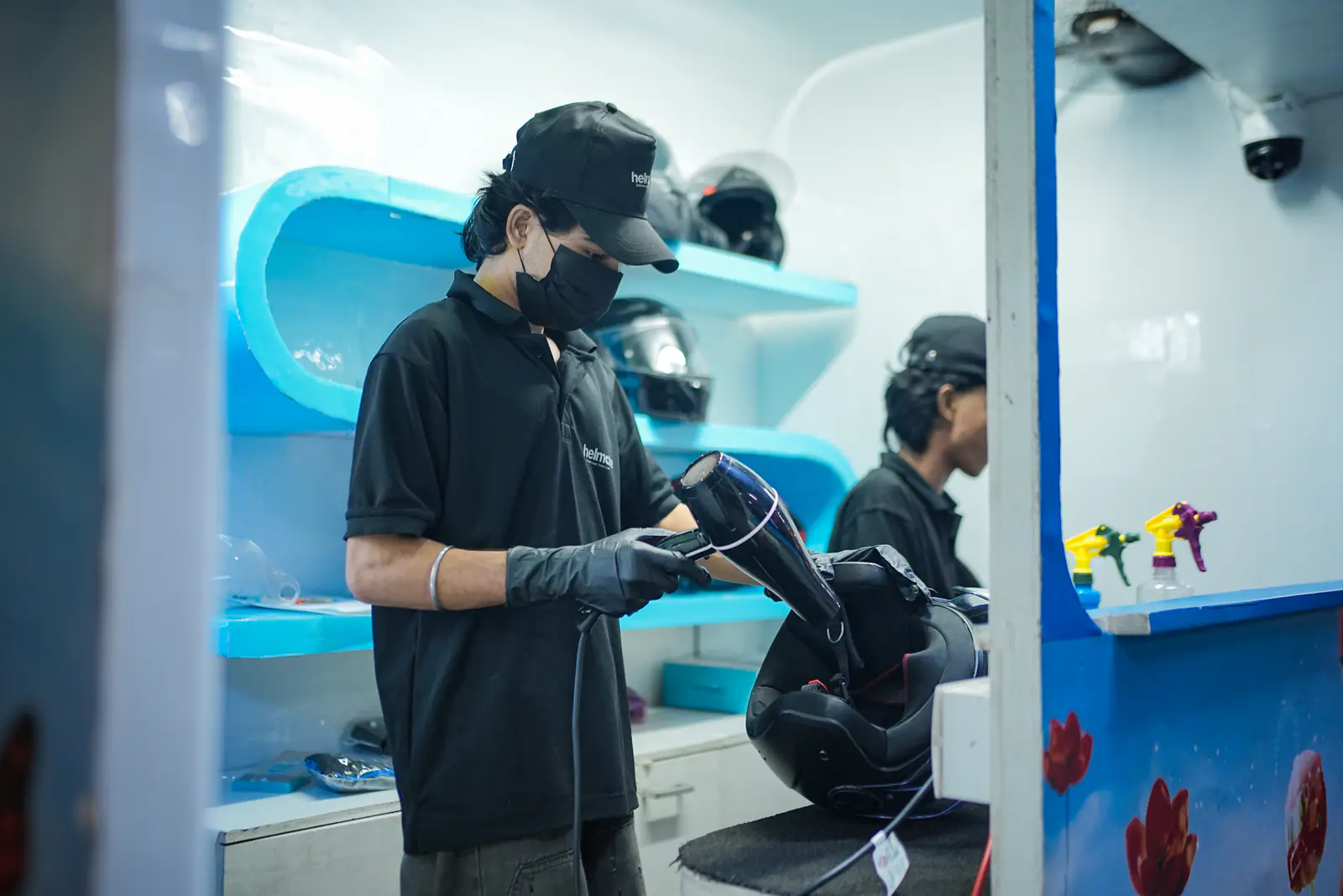 Final inspection of a cleaned visor before handover